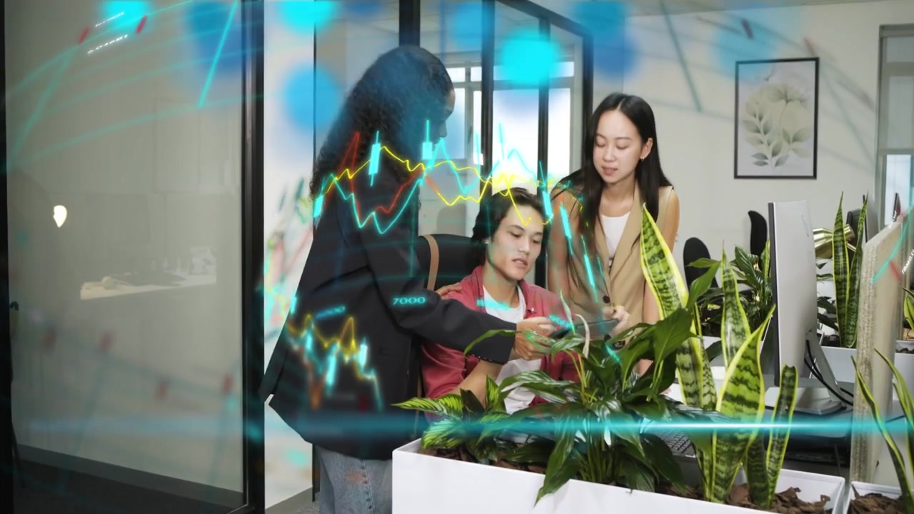 Tablet user coming showing tech team leaning tapping laptop reviewing animated waves overlay screen