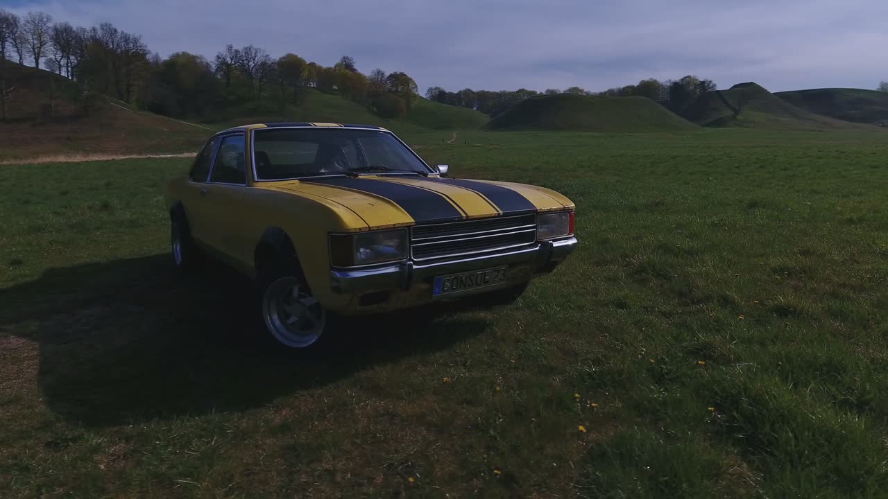 Yellow With Black Stripes Classic Ford Consul 1973. 4K Aerial Orbit Footage