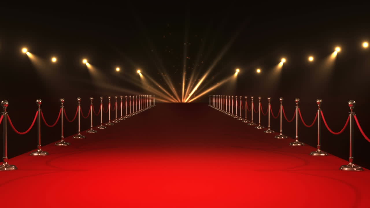 Animazione di forme caleidoscopiche oro e rosse su una location con tappeto rosso con faretti mobili