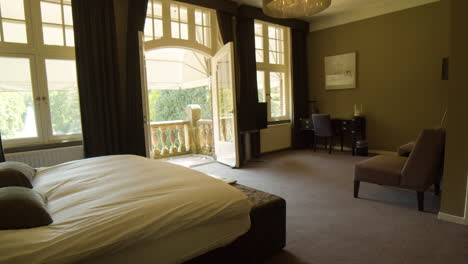 dolly of beautiful hotel room with a stone balcony