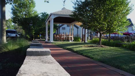 Table-with-chairs-upside-down-under-a-gazebo-on-a-calm-summer-afternoon