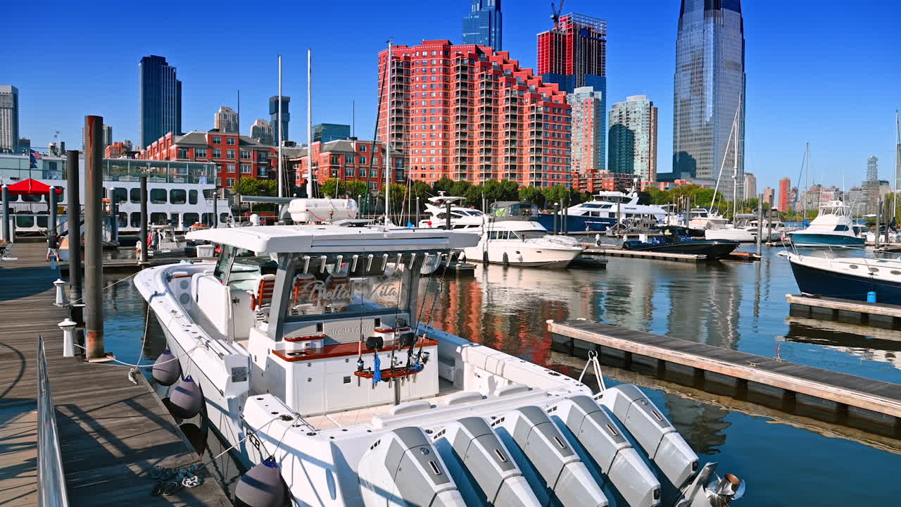 Little powerful motorboat standing at the pier. Yacht club in modern Jersey, New Jersey, USA