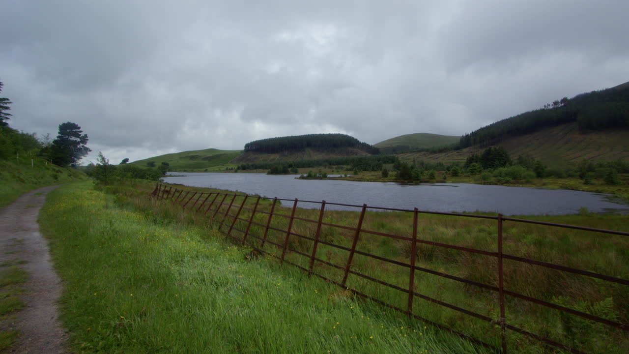 extra wide shot looking West with footpath and metal fence at Cogra Moss in West lake district
