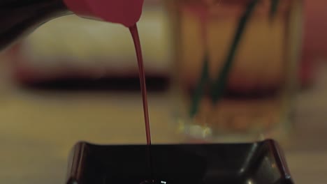 soy sauce is poured into the bowl slow mortion