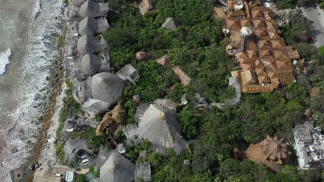 Papaya-Playa-Project-luxury-hotel-and-tropical-coast-in-background,-Tulum-in-Mexico