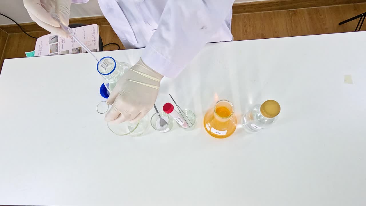 Scientist conducts a bromothymol blue experiment, showcasing color changes in a lab setting with precise movements and clear lighting