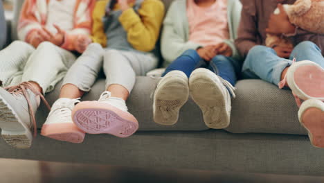 Family,-feet-and-children-watching-tv