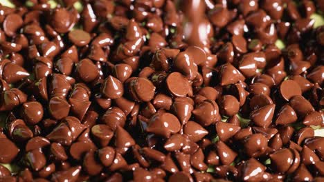 chocolate chips cascading in a continuous flow