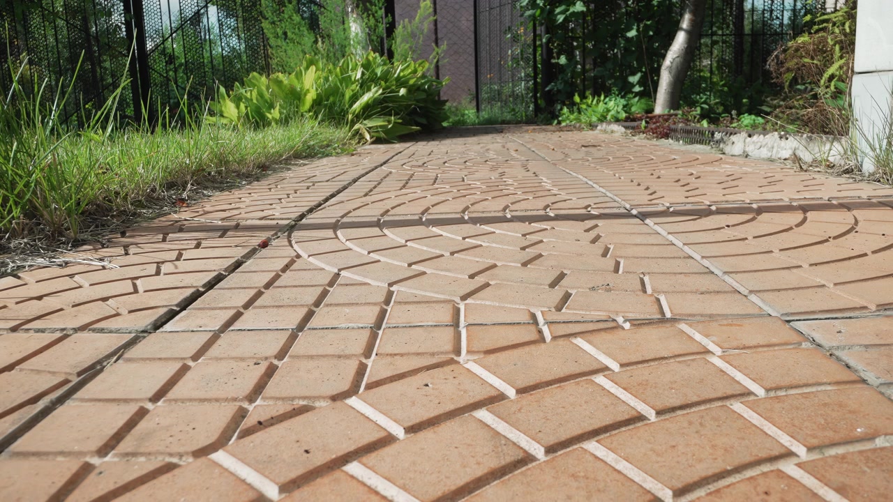 Time Lapse of Shadows Moving Across a Paved Garden Path
