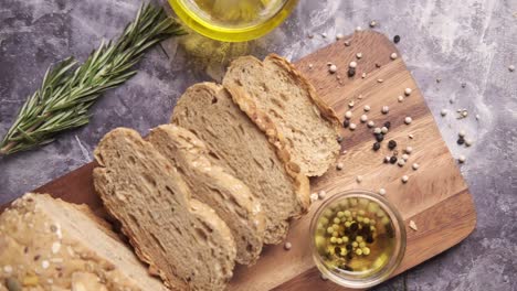 slice of whole meal bread and olive oil on table