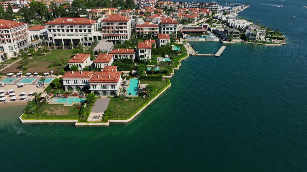 Seaside luxury resort with pools and red roofs in Portonovi, Montenegro, aerial view