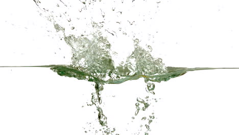 Lemon-plunging-into-water-on-white-background