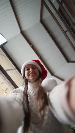 girl in santa hat selfie