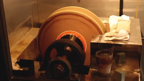 potter's wheel spinning with clay and tools