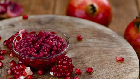 preserved pomegranate seeds on a rotating plate (seamless loopable)