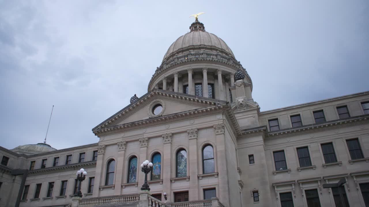 Wide, from below: Stormy skies over the Mississippi State Capitol building. Jackson, MS