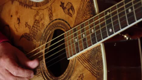 vintage acoustic guitar being played