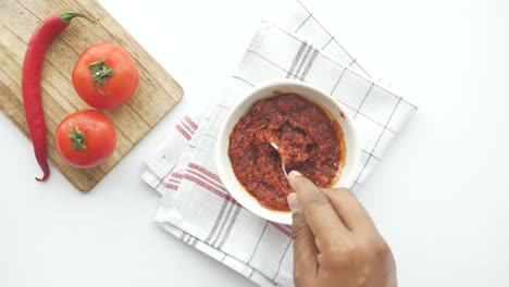 Tomato-paste-in-a-jar-with-fresh-tomato-on-table