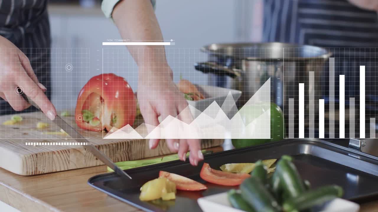 Mature woman chopping peppers on board preparing meal sparking data charts evolving over right side