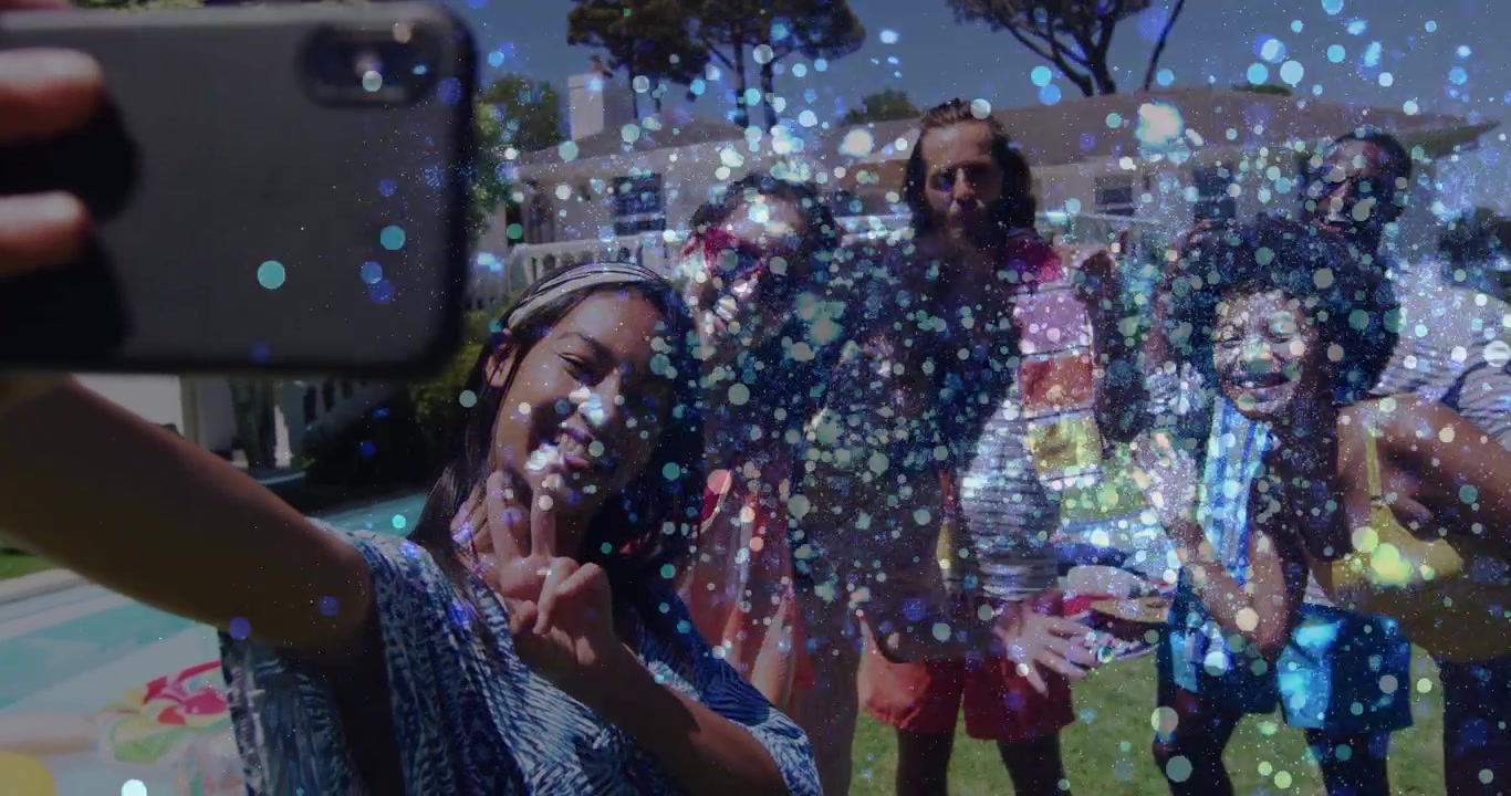 woman holding smartphone taking social media selfie with friends by pool activating bubble overlay