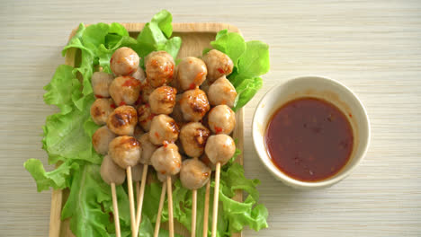 grilled meatballs skewer with spicy dipping sauce