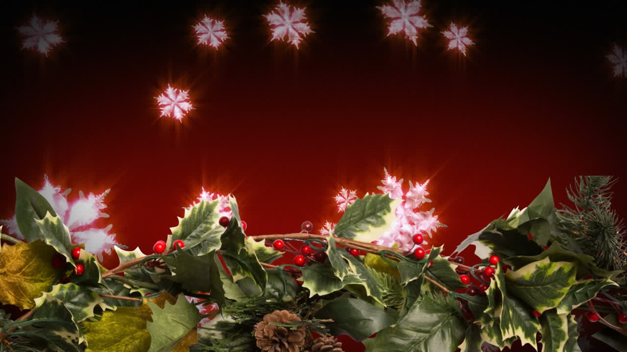 Holly and falling snowflakes