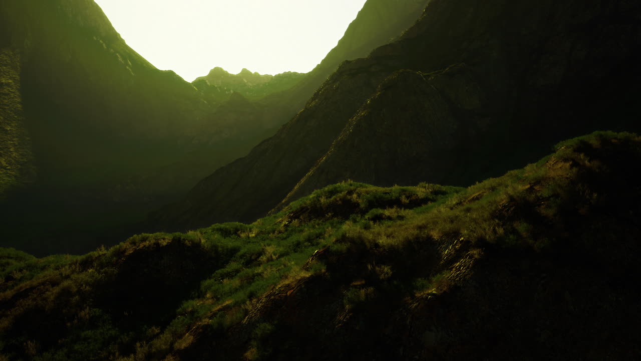 Vibrant mountain landscape bathed in golden sunlight during twilight hours
