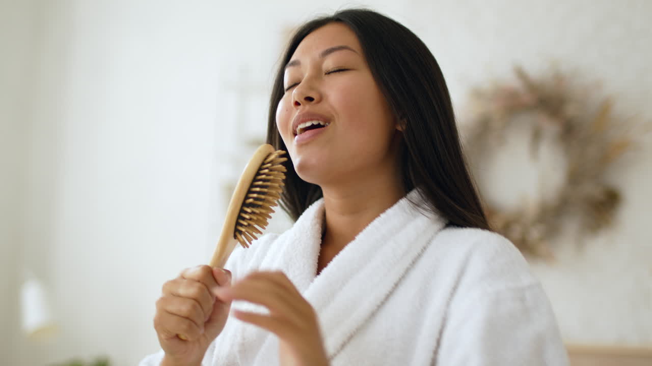 Woman Singing with a Hairbrush
