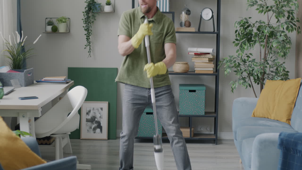 Man Cleaning and Dancing