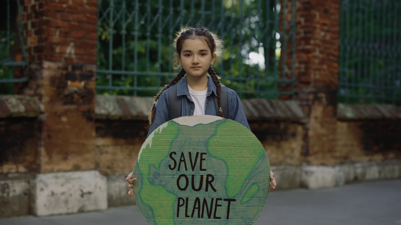 Young girl protesting for environmental protection