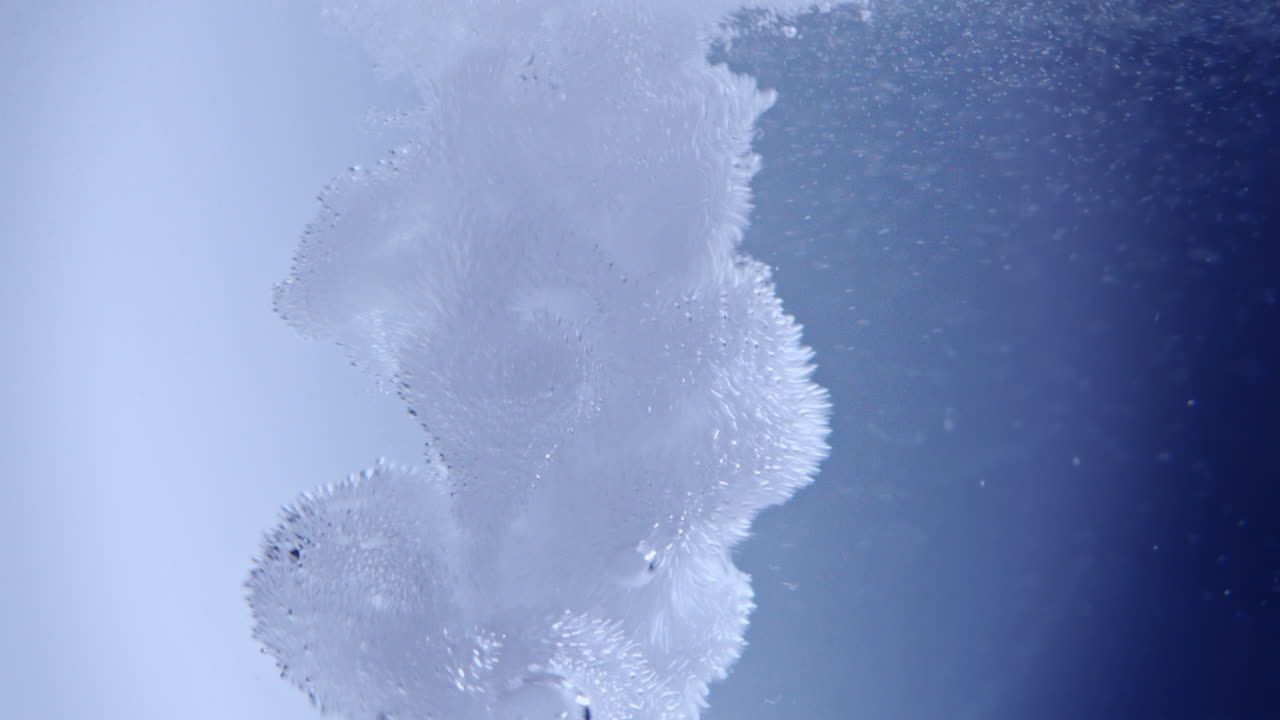 Dynamic Water Bubbles Against Blue Background