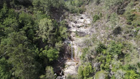 fecha de barjas waterfall streaming to beautiful natural pool, peneda-gerês national park