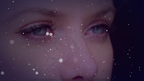 animation of spots of light over caucasian woman''s face