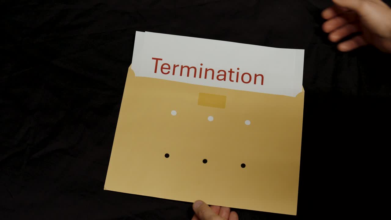 A hand opens a brown envelope labeled “sensitive data” to reveal a termination document, symbolizing confidential HR communication and workplace privacy