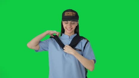 Happy-Indian-female-security-guard-getting-ready-for-duty-Green-screen