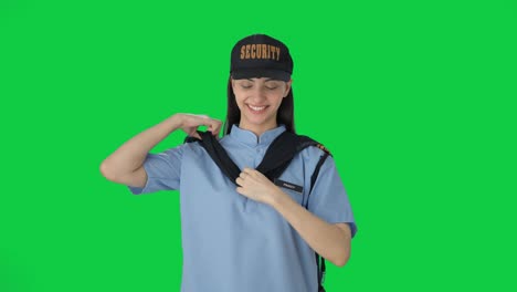 happy indian female security guard getting ready for duty green screen