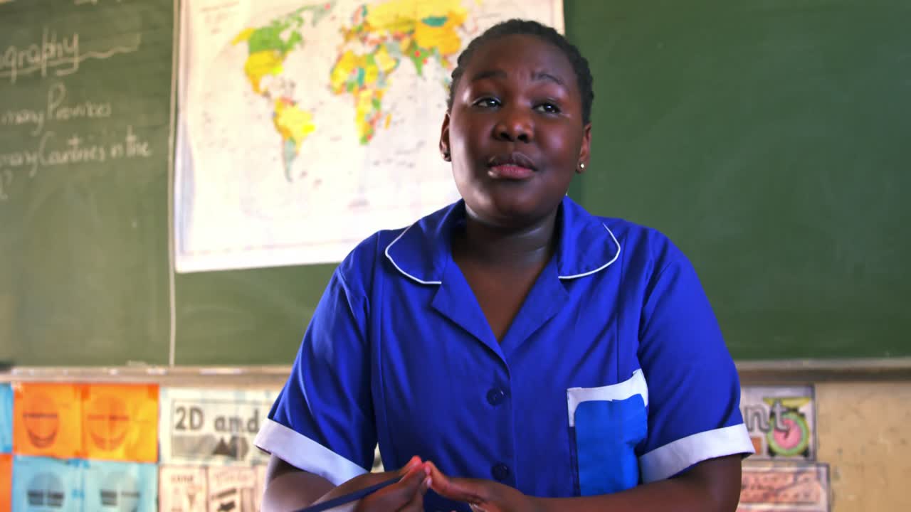 Schoolgirl in a lesson at a township school 4k