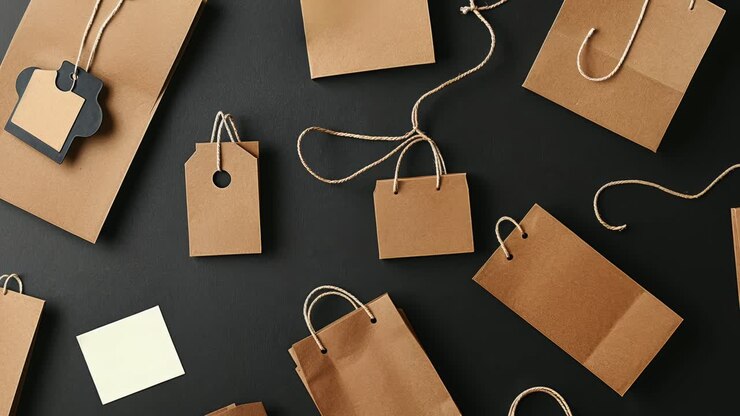 Various Brown Paper Bags and Tags on Dark Background
