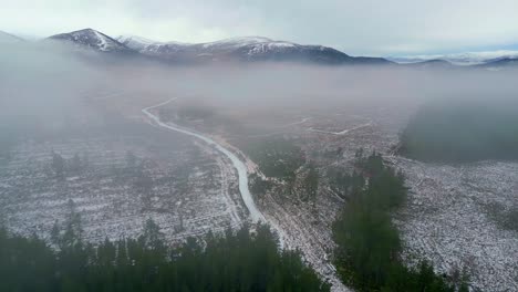 aerial ascending footage of winter highlands