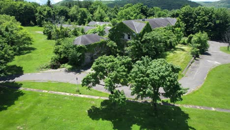 abandoned hospital buildings at letchworth village complex- insane asylum in upstate new york- aerial fly over