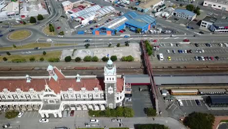 Drone-view-of-the-historic-railway-station-of-Dunedin,-New-Zealand