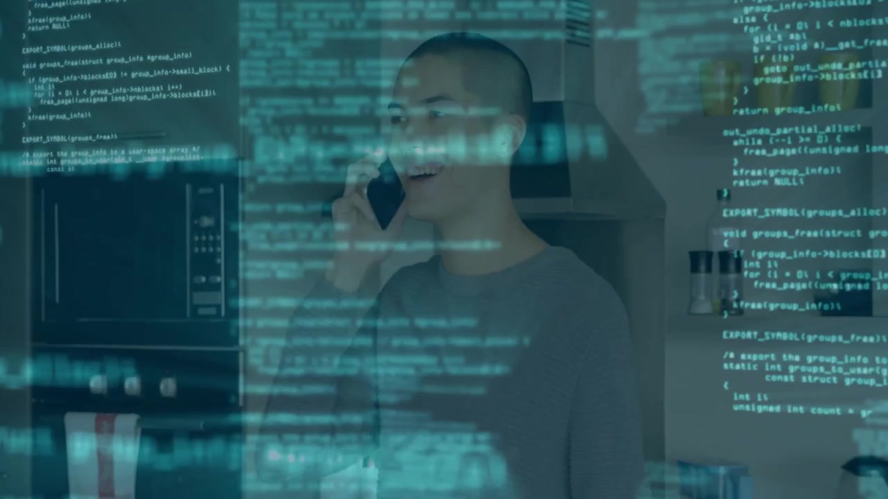 Man picking up smartphone and initiating call while code overlay drifting across kitchen tech demo