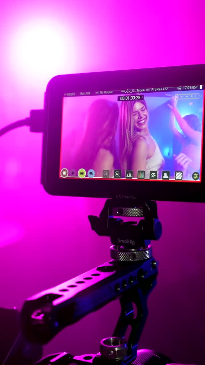 Behind the scenes video with women dancing at a party