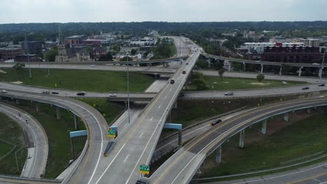 Busy-Traffic-Drives-In-All-Directions-Through-Metropolitan-City-On-Highway-With-Multiple-Intersections