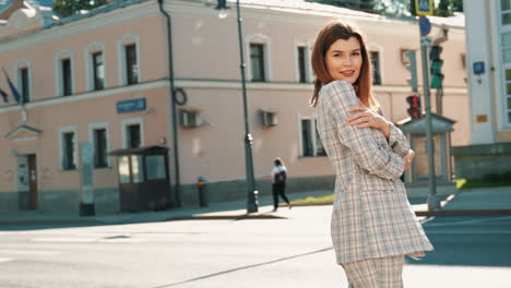 woman in a plaid suit on a city street