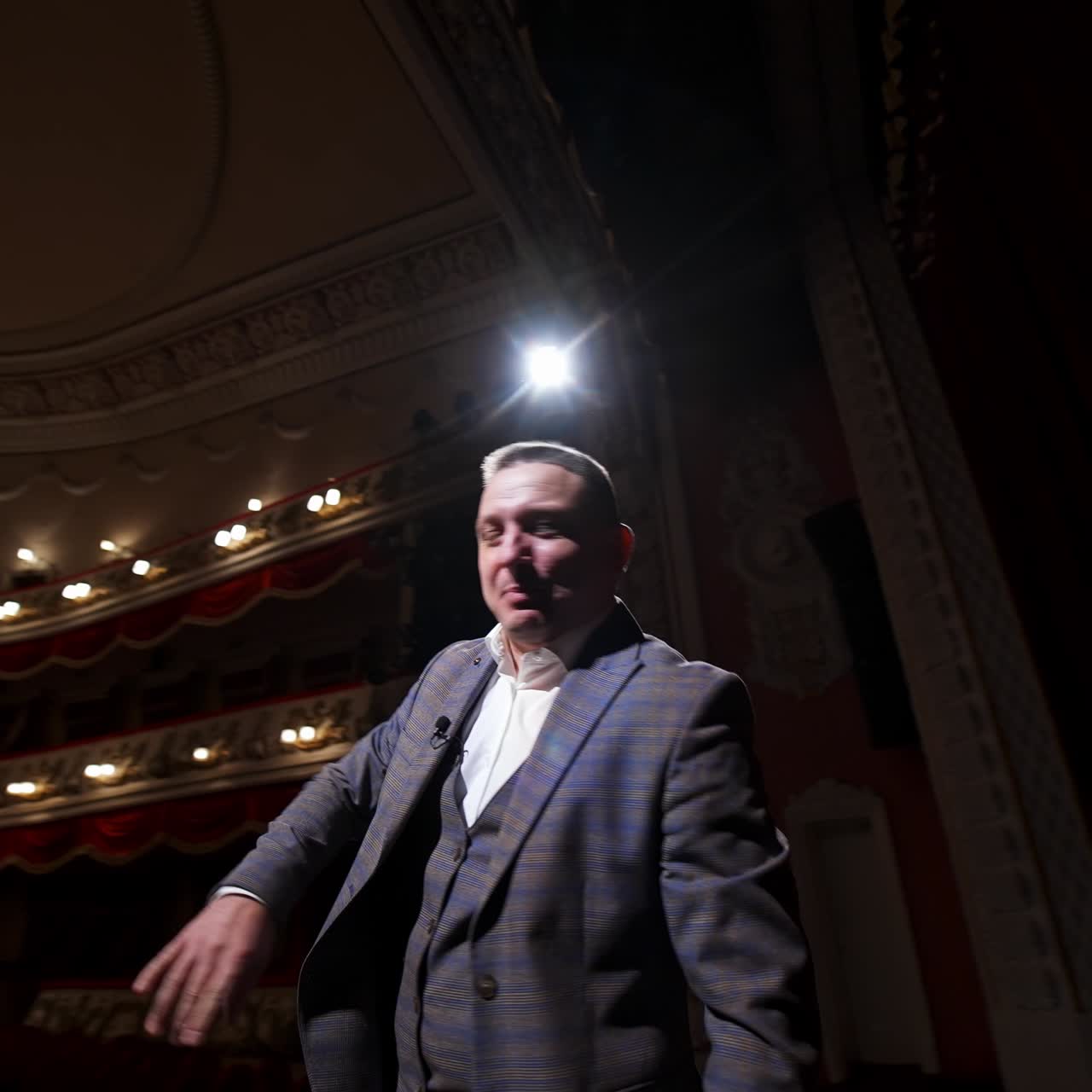 Inspirational male speaker does presentation of new technological product. Motivational Speaker