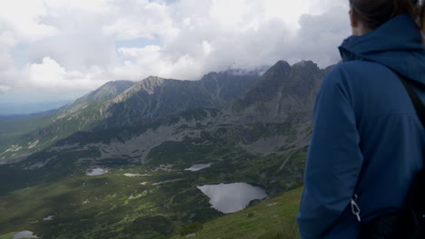 Shot-of-woman-enjoying-the-scenery-of-the-tatra-mountains-including-its-wonderful-lakes