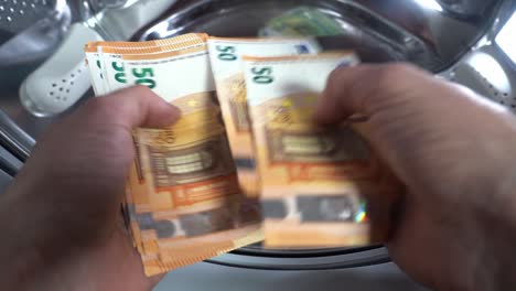 money hanging to dry with clothespin - euro money banknotes after  washing machine - illegal cash 50, 100 €  and mafia money laundering - increase in the cost of living, energy and gas