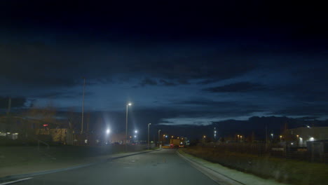 evening scenery of moving street lights out of car after dark rises