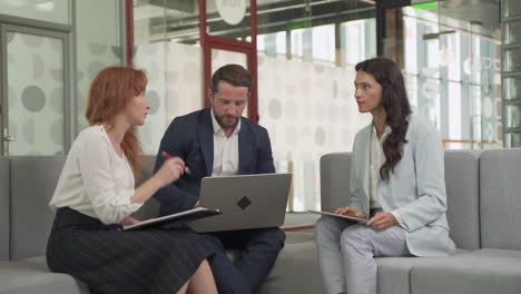 Work-Team-Composed-Of-Two-Women-And-Two-Men-In-A-Meeting-Put-Things-In-Common